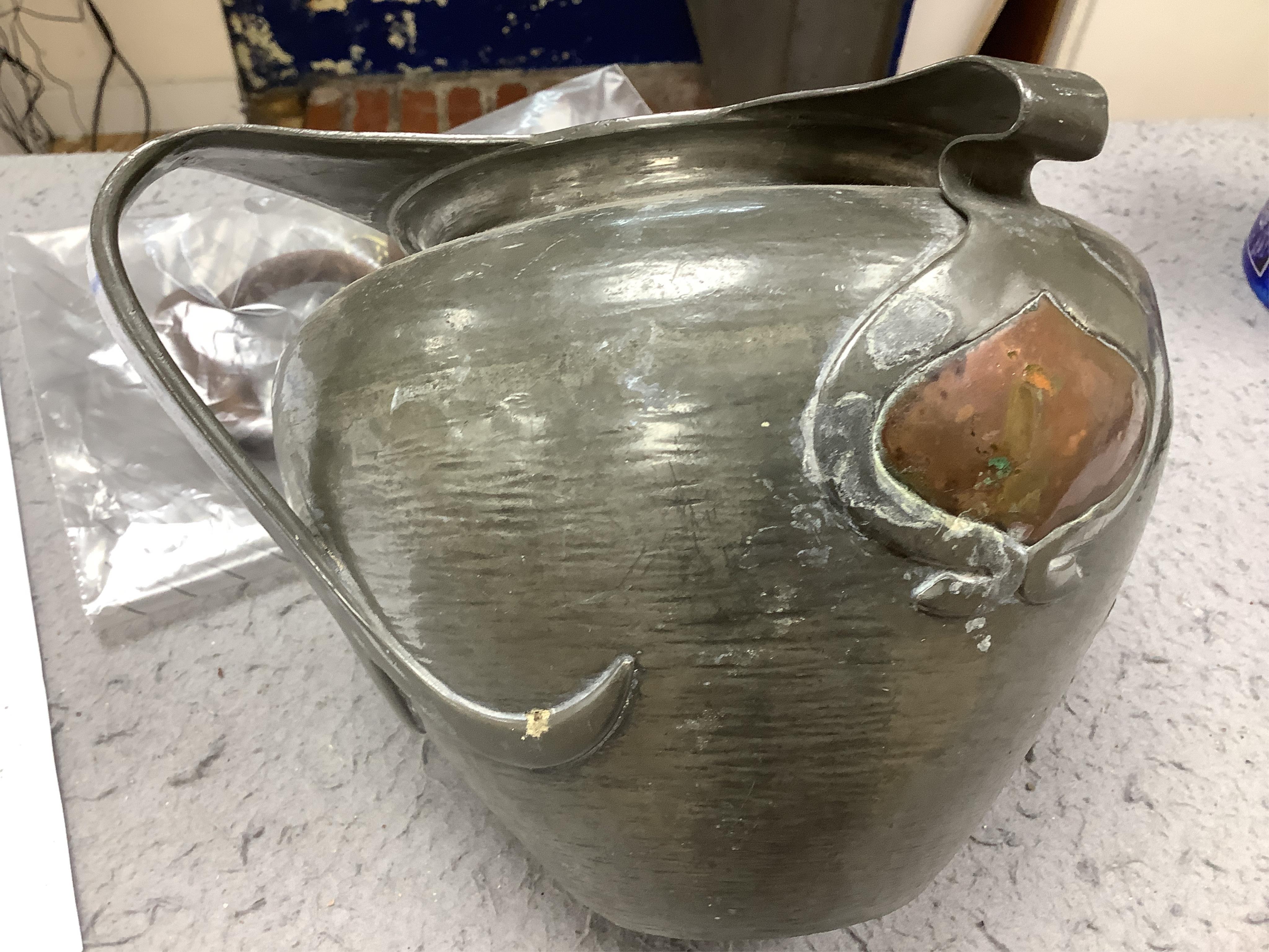 Oliver Baker for Liberty & Co, a Tudric pewter and copper vase, no.0864, c.1910, 25cm wide. Condition - fair to good
